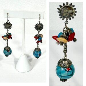 Silver-tone and bead boho dangle earrings.